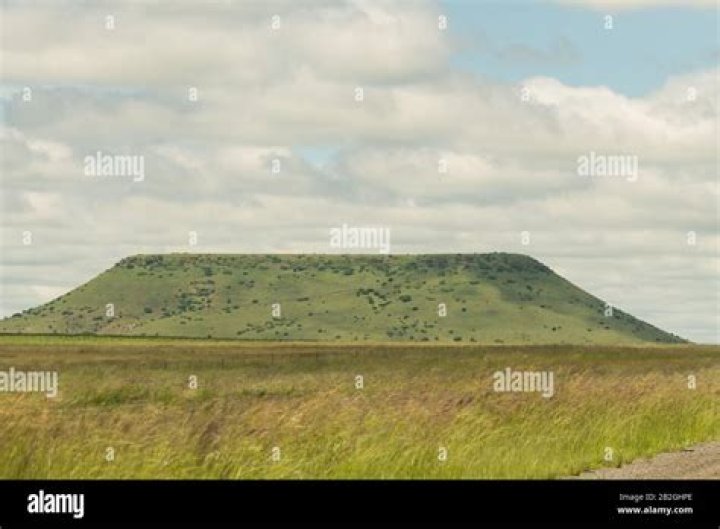 How are flat topped hills formed?