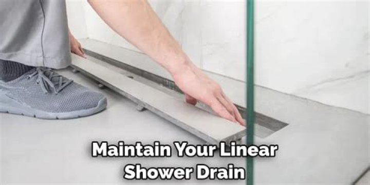 How do you clean a linear drain?