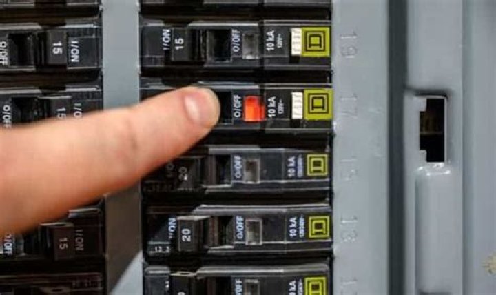 How do you reset a circuit breaker with a test button?