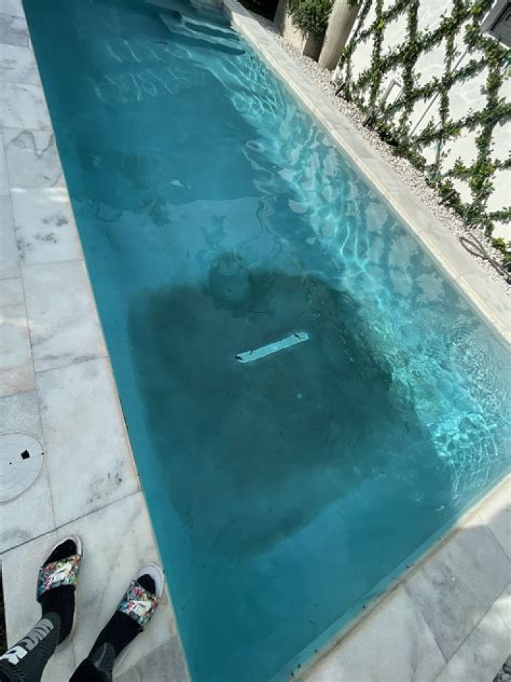 What is mottling of pool plaster?